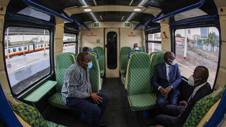 President Uhuru Kenyatta and Transport CS James Macharia in a train. PHOTO/PSCU  