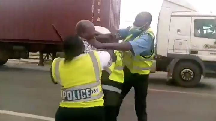 The three cops attacking a motorist in Nakuru. 
