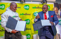 Charles 'Ugali man' Odongo and Dedan Mungai, General Manager OdiBets. PHOTO/COURTESY