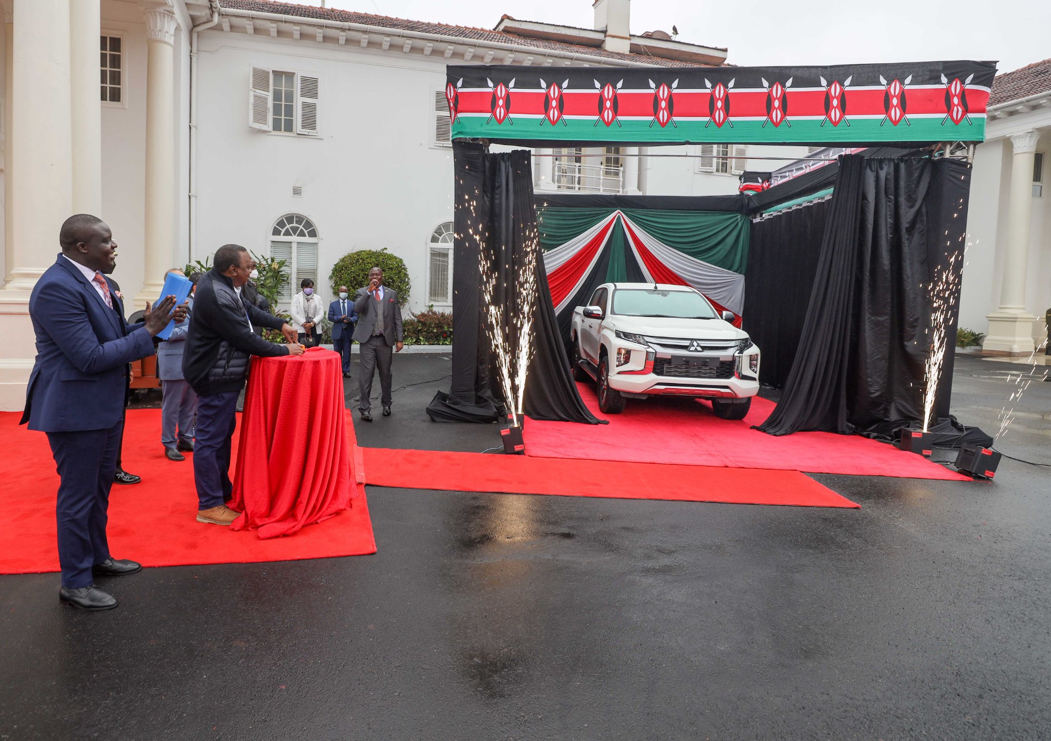 David Osiany, Uhuru Kenyatta and a Mitsubishi L200. PHOTO/PSCU
