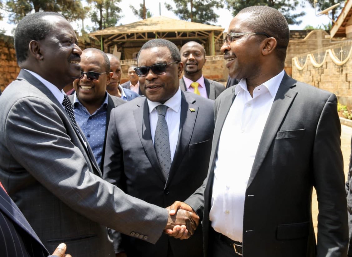 Raila Odinga and Mwangi Wa Iria shaking hands. PHOTO/TWITTER
