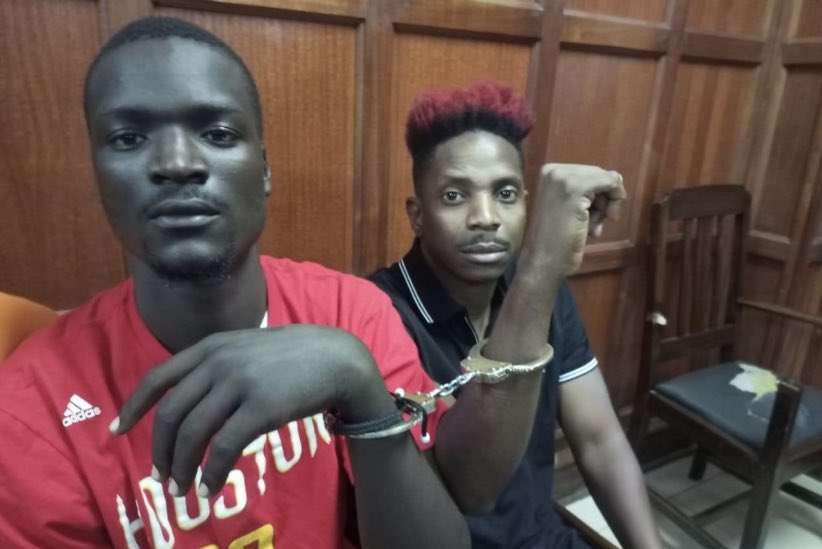 Eric Omondi and one of his co-accused persons at Milimani Law Courts. PHOTO/TWITTER