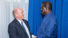 Chris Coons and Raila Odinga. PHOTO/COURTESY