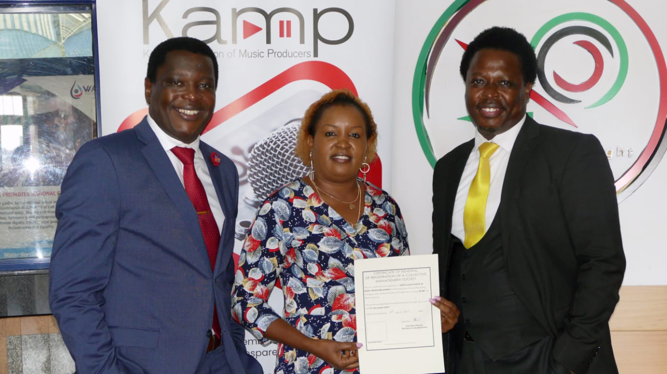KAMP Board Chairperson Faith Kithele displaying the certificate. PHOTO/COURTESY