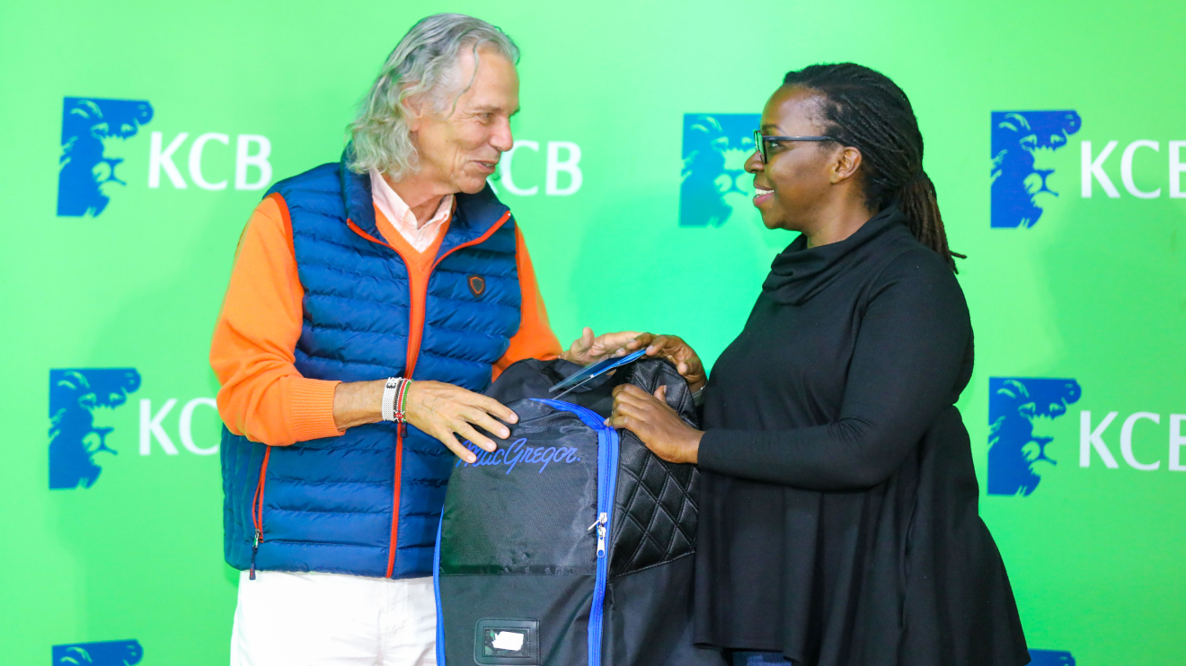 KCB Bank Group, Head integrated Marketing, Ceasarine Nkatha (Right) awards Thika Golf Member, Thomas Thal (Left) after winning the KCB East Africa Golf Tour held in Thika Golf Club. PHOTO/KCB