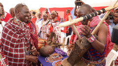 William Ruto admiring Maasai cultural artefacts. PHOTO/COURTESY