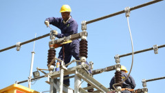 Kenya Power employees working on a power line. PHOTO/COURTESY