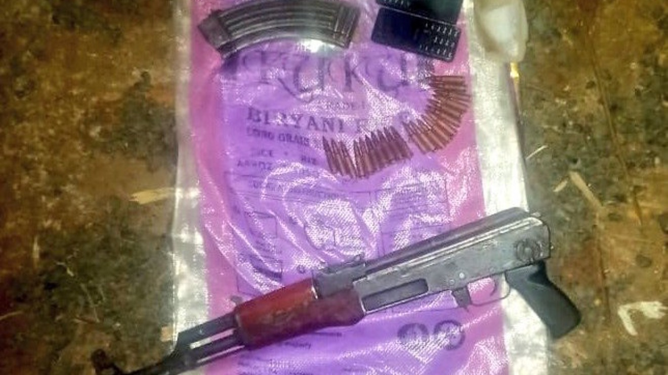 AK47 riffle, rounds of ammunition and mobile phones recovered from fallen thugs. PHOTO/DCI