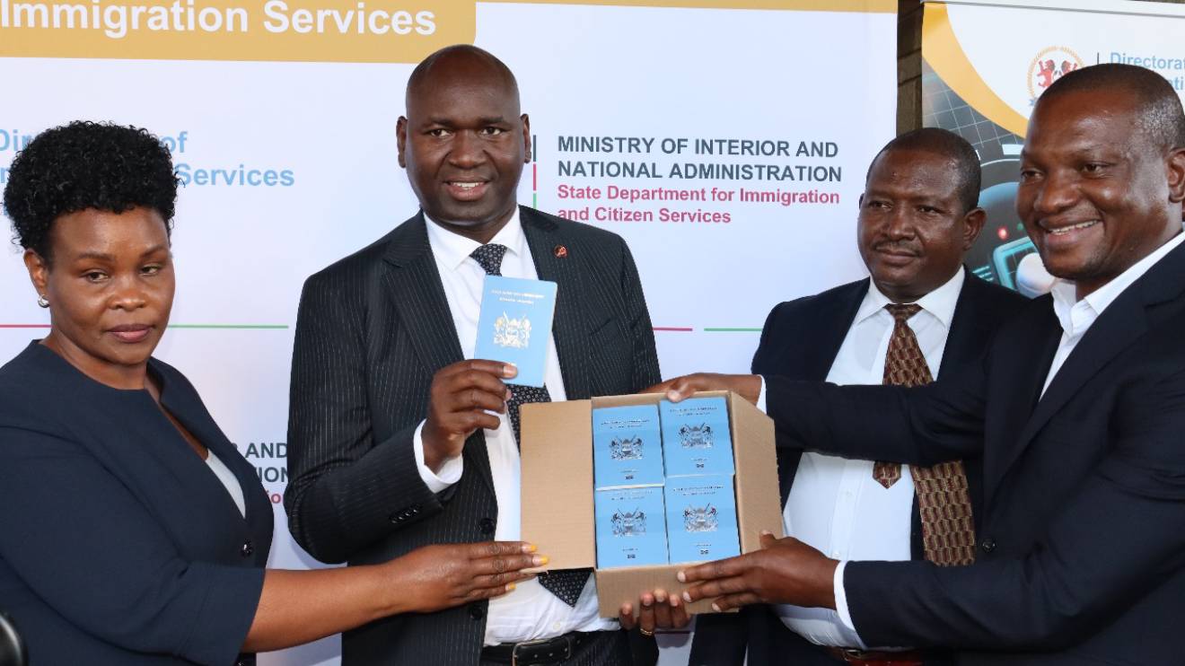 Evelyn Cheluget and Julius Bitok receiving the consignment of passport booklets. PHOTO/COURTESY