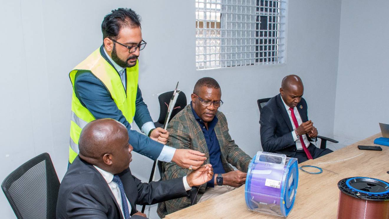 Eliud Owalo and John Tanui inspecting the locally manufactured fibre optic cables. PHOTO/COURTESY