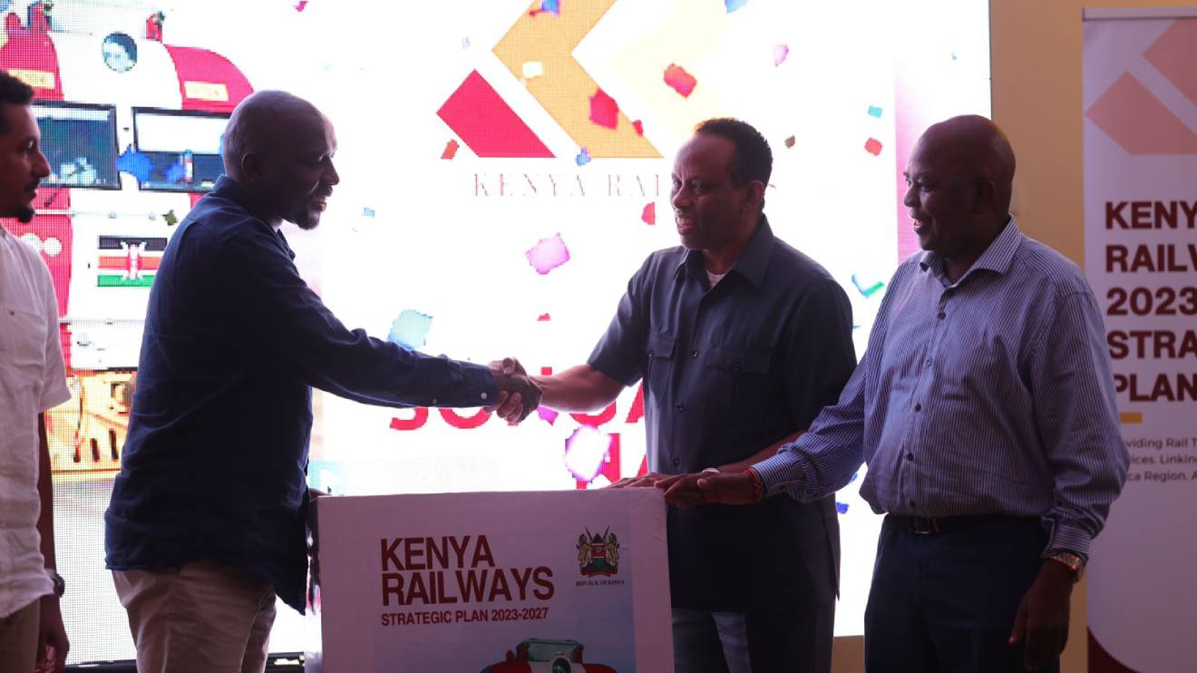Abdi Bare Duale and Kipchumba Murkomen shaking hands during the launch of the Kenya Railways Strategic Plan. PHOTO/COURTESY