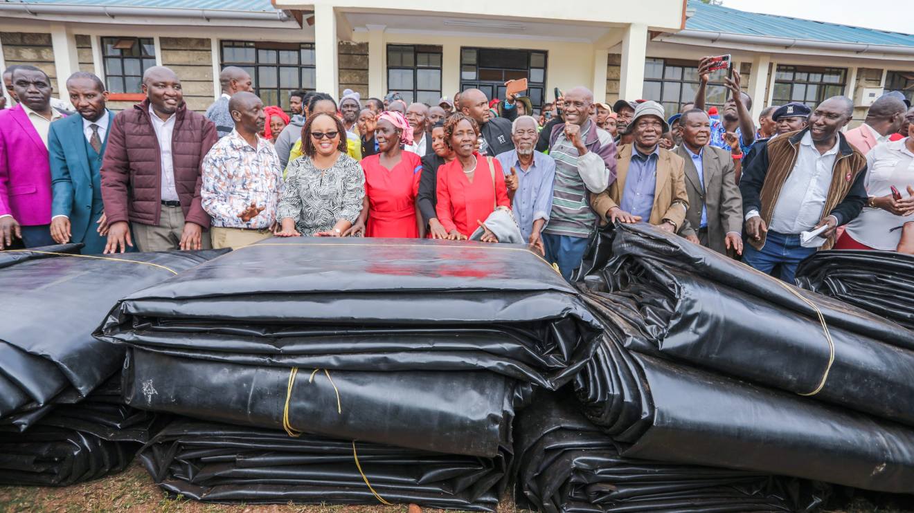 Anne Waiguru distributing pond liners. PHOTO/COURTESY