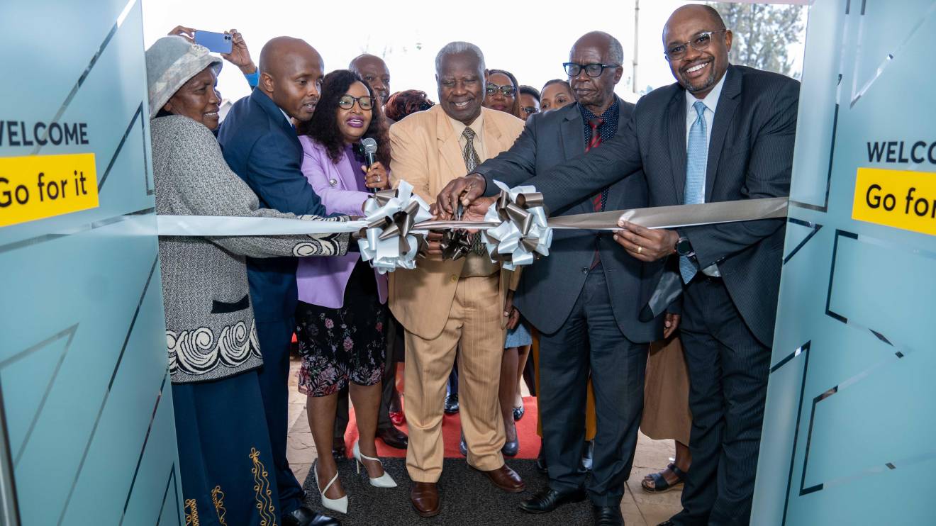 : From R-L NCBA Group Director, Retail Banking Tirus Mwithiga officially leads NCBA Customers and Staff in the official launch of the NCBA Githunguri Branch held in Githunguri Town. PHOTO/COURTESY