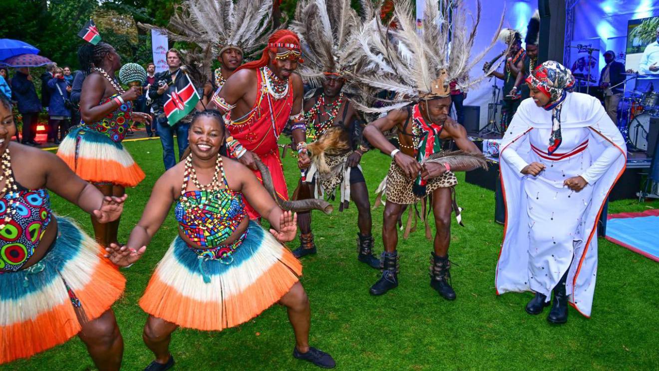 Ummi Bashir joining traditional dancers at an event, PHOTO/COURTESY