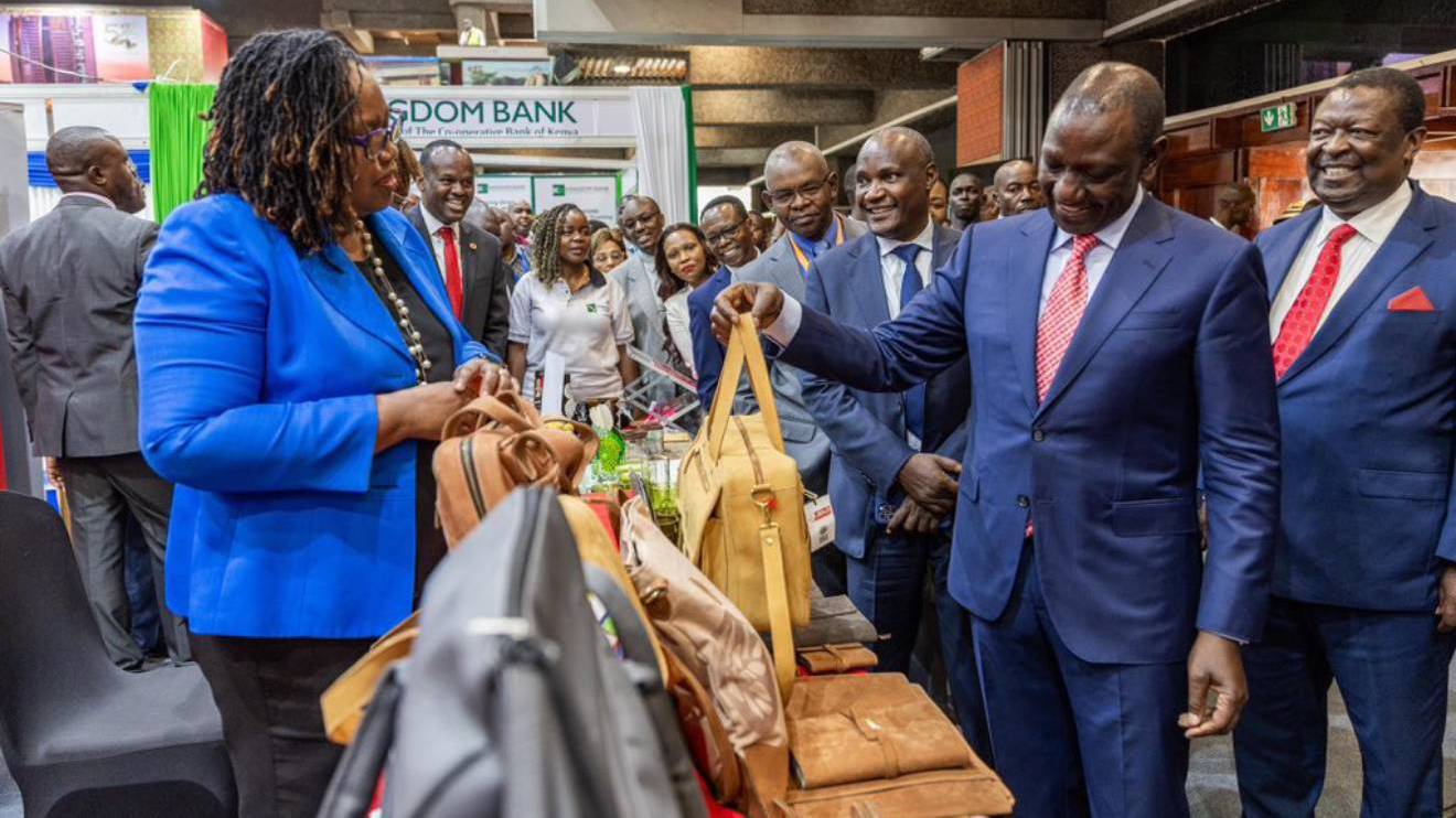 William Ruto (holding a bag) at the Inua Biashara exhibition. PHOTO/COURTESY