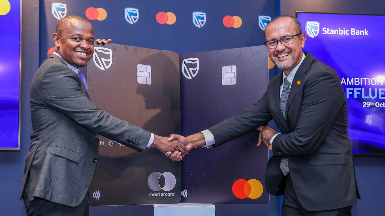 Abraham Ongenge (Left) and Senior Vice President and Shehryar Ali (Right) during the official launch of the Stanbic World Elite Premium metallic cards in partnership with Mastercard. PHOTO/COURTESY