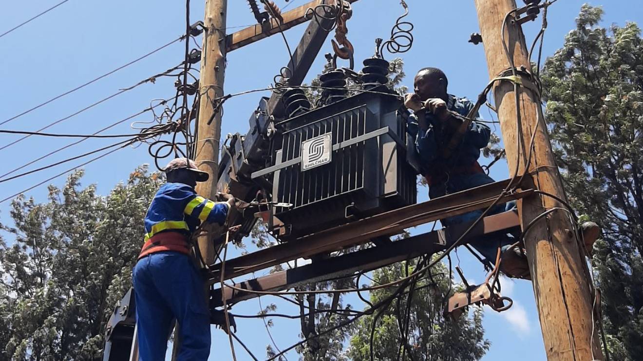 Kenya Power technicians working on a transformer. PHOTO/COURTESY