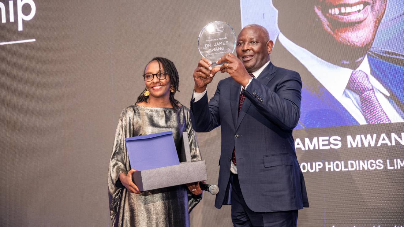 Dr. James Mwangi (Right) aftre receiving his award. PHOTO/COURTESY