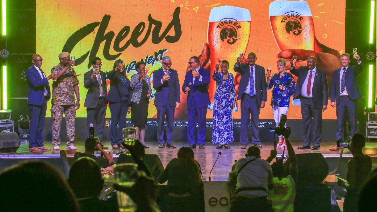 Officials from East African Breweries Limited (EABL) and other dignitaries pose at an event celebrating 100 years of Tusker. PHOTO/COURTESY