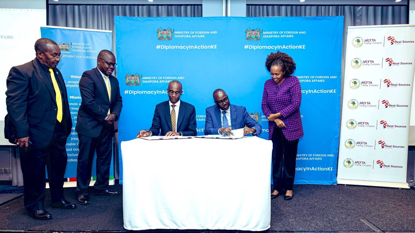 Felix Chege and Korir Sing’Oei signing the dea. PHOTO/COURTESY