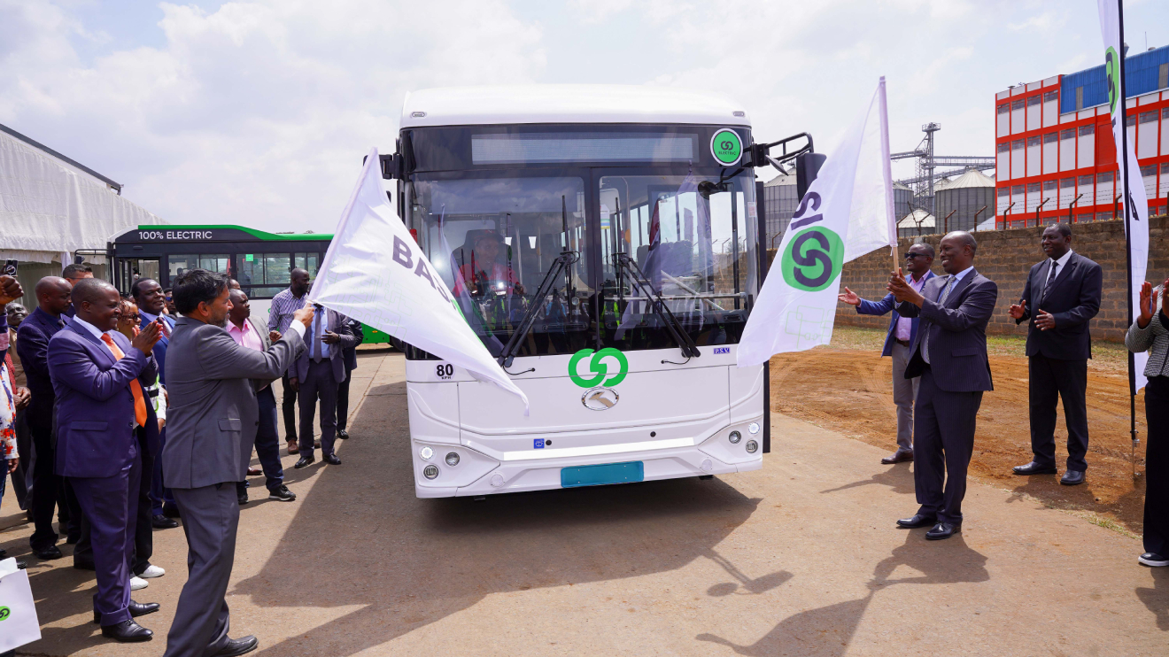 BasiGo CEO, Jit Bhattacharya (left) and Lee Kinyanjui, CS Investments, Trade and Industry flag off one of the locally assembled BasiGo buses under the King Long brand. PHOTO/COURTESY